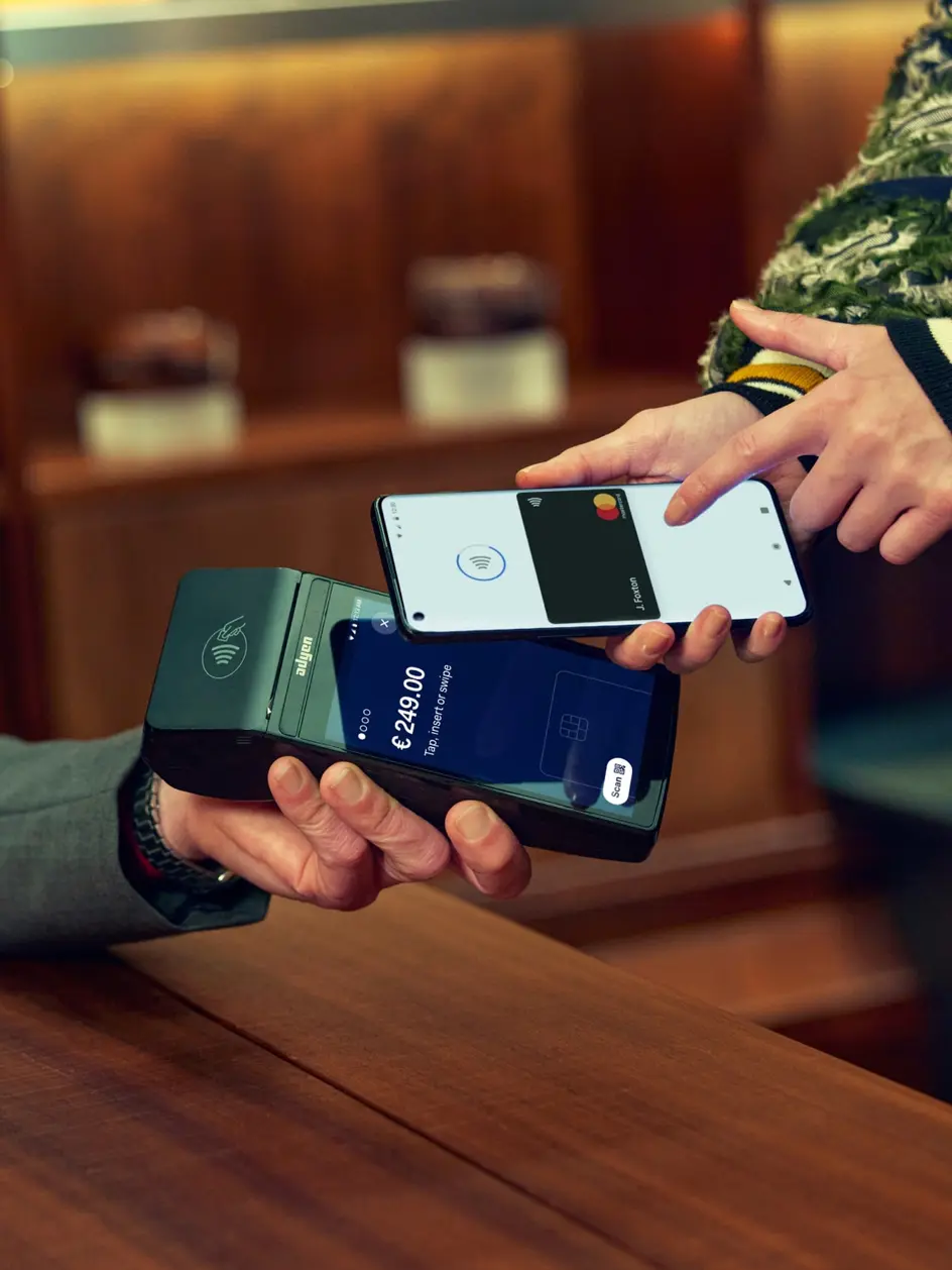 customer using touch pay on a payment terminal in-store